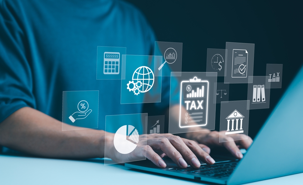 Digital,Tax,Calculation,And,Management,Concept.,A,Person,Uses,Laptop Digital,Tax,Calculation,And,Management,Concept.,A,Person,Uses,Laptop